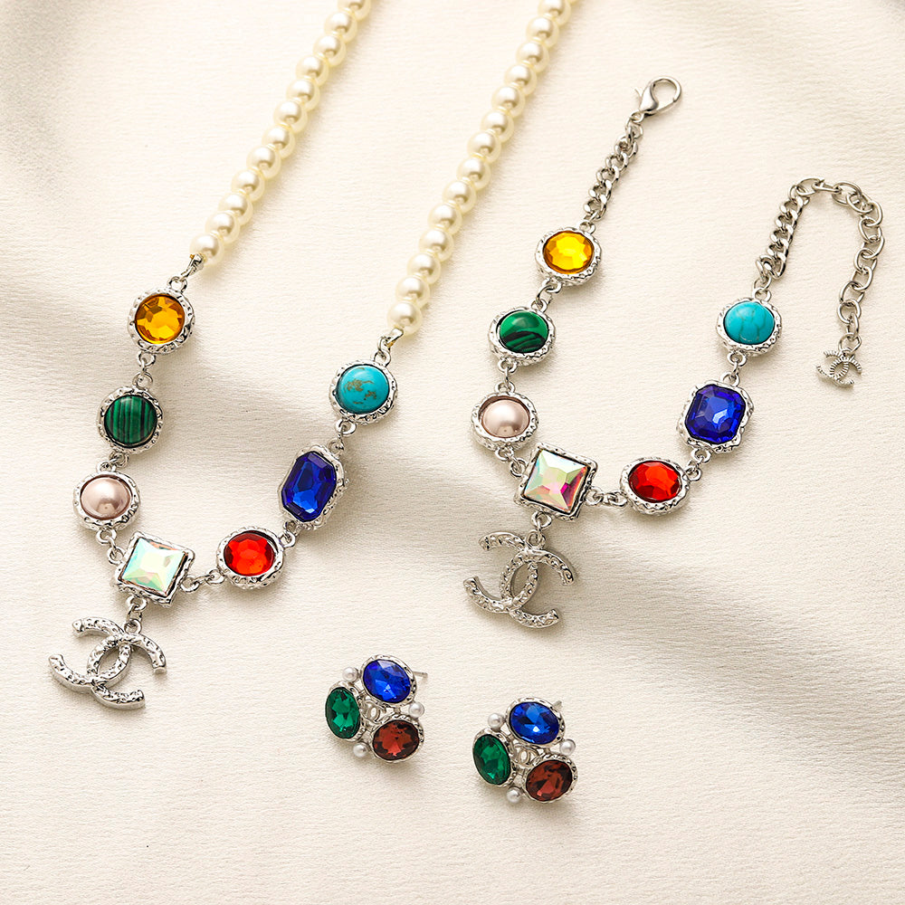 Set di collana e bracciale in lega con logo impresso