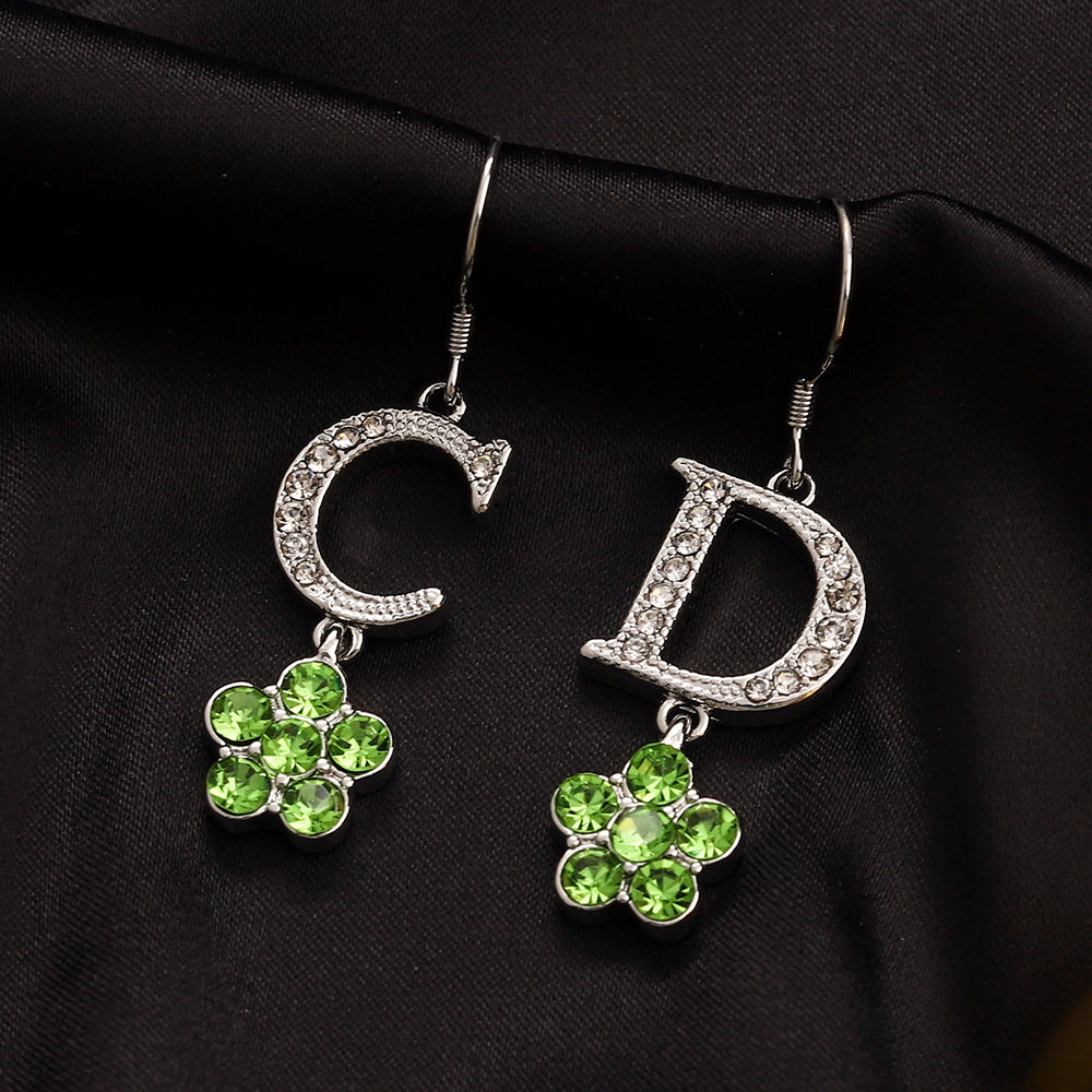 Set di orecchini, bracciale e collana in lega con logo stampato
