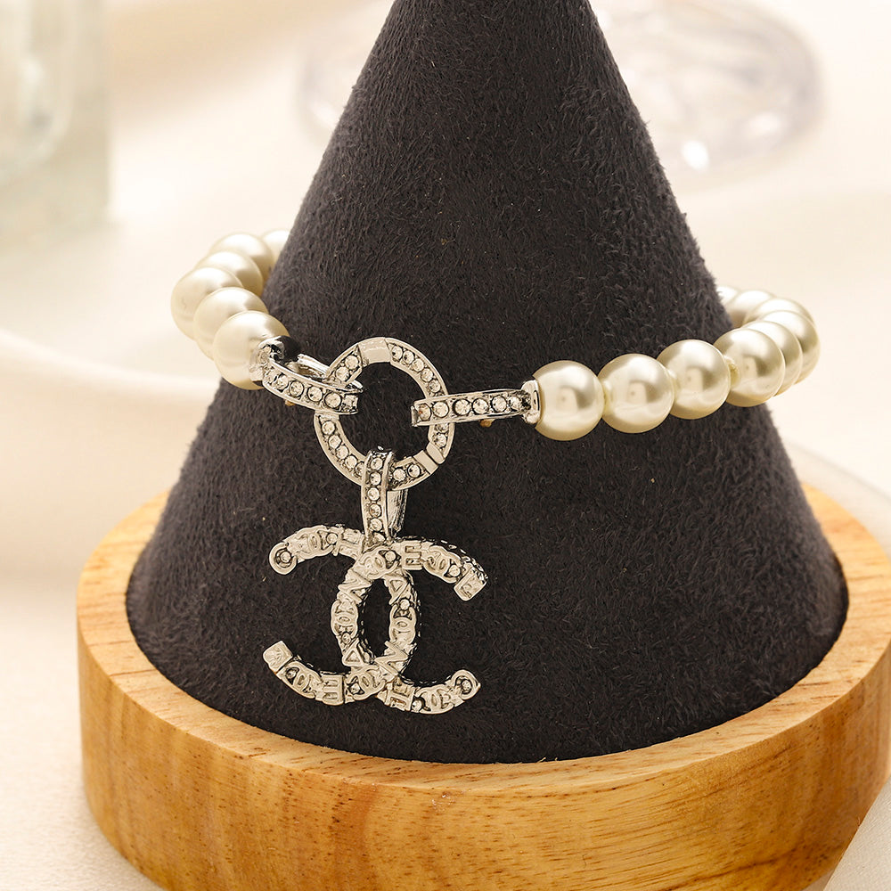 Set di Orecchini, Bracciale e Collana in Lega con Logo Stampato