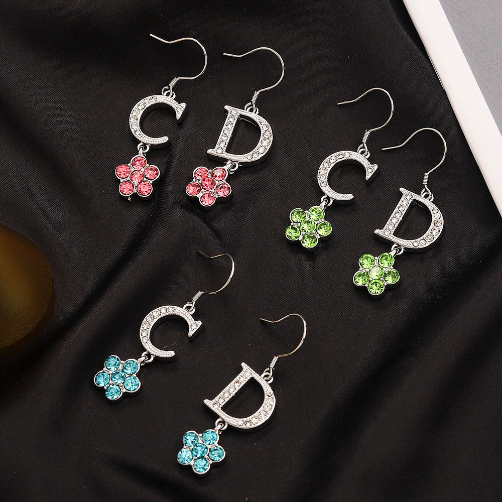 Set di orecchini, bracciale e collana in lega con logo stampato