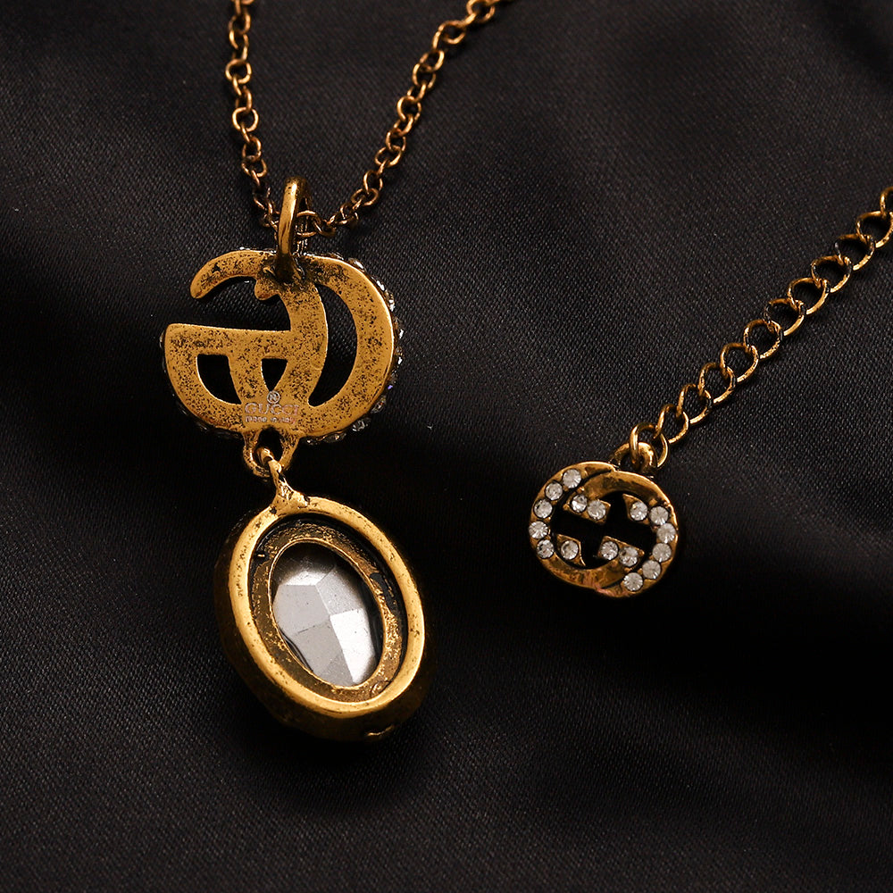 Set di orecchini, bracciale e collana in lega con logo impresso