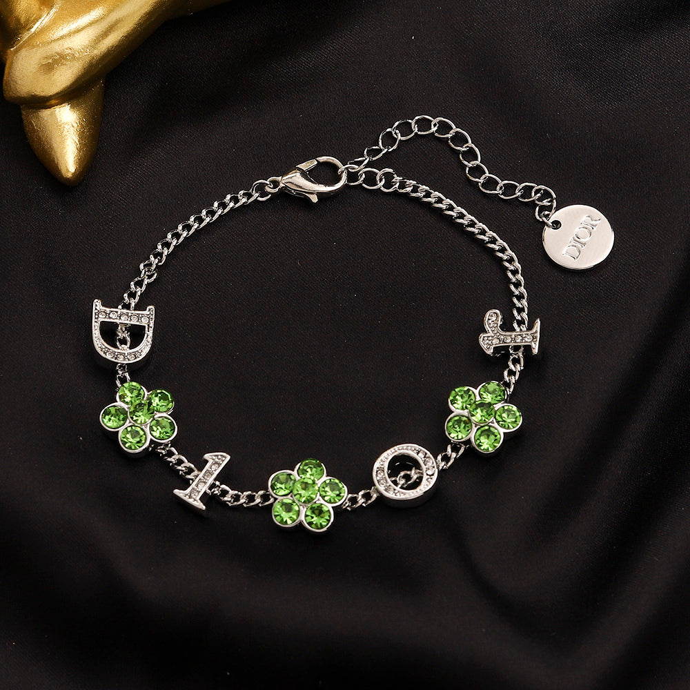 Set di orecchini, bracciale e collana in lega con logo stampato