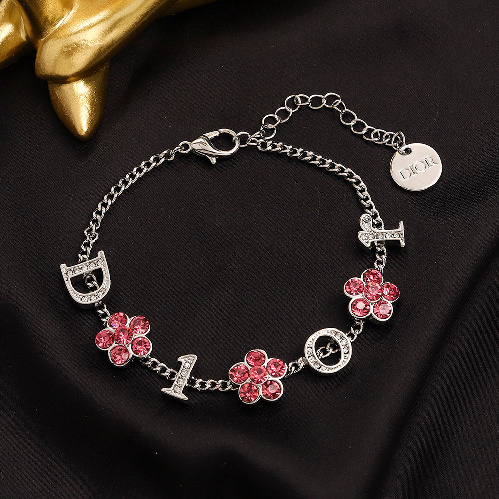 Set di orecchini, bracciale e collana in lega con logo stampato