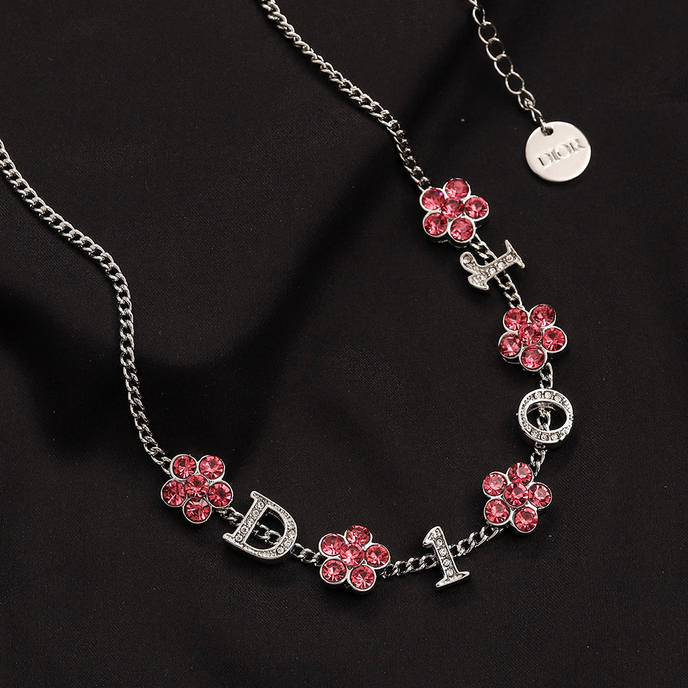 Set di orecchini, bracciale e collana in lega con logo stampato